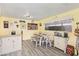 Bright dining area with a wooden table and bench seating, lit by a window at 7 Sturm St, Henderson, NV 89015