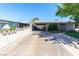 View of the exterior showing the carport and long driveway at 7 Sturm St, Henderson, NV 89015