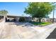 Quaint single story home with a carport and mature shade tree at 7 Sturm St, Henderson, NV 89015