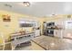 View of the kitchen showing an island, eating area, and stainless appliances at 7 Sturm St, Henderson, NV 89015