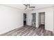 Bright bedroom with wood-look floors and a modern ceiling fan for comfortable living at 7100 Pirates Cove Rd # 2065, Las Vegas, NV 89145