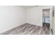 Well-lit bedroom with a doorway leading to a laundry area equipped with modern appliances at 7100 Pirates Cove Rd # 2065, Las Vegas, NV 89145