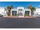 Community clubhouse features expansive windows, manicured landscaping, and ample parking at 7100 Pirates Cove Rd # 2065, Las Vegas, NV 89145
