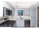 Bright updated kitchen featuring stainless steel appliances and grey cabinets, and new countertops at 7100 Pirates Cove Rd # 2065, Las Vegas, NV 89145