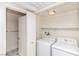 Functional laundry room equipped with a washer, dryer, and convenient storage options at 7100 Pirates Cove Rd # 2065, Las Vegas, NV 89145