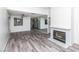Open living area with modern flooring, fireplace, and views into the updated kitchen at 7100 Pirates Cove Rd # 2065, Las Vegas, NV 89145