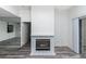 The living room has wood floors, access to a fireplace, and access to a covered outdoor patio at 7100 Pirates Cove Rd # 2065, Las Vegas, NV 89145