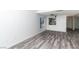 Clean and open living room with hard surface flooring, a ceiling fan, and lots of natural light at 7100 Pirates Cove Rd # 2065, Las Vegas, NV 89145