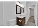 Comfortable bathroom with vanity, a framed mirror, and a toilet at 7257 Early Pioneer Ave, Las Vegas, NV 89129
