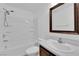 Bright bathroom featuring a bathtub with shower and vanity with framed mirror at 7257 Early Pioneer Ave, Las Vegas, NV 89129