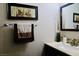 Stylish bathroom featuring a vanity with decorative accents, creating a serene and elegant space at 7257 Early Pioneer Ave, Las Vegas, NV 89129