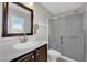 Well-lit bathroom includes a vanity, a shower, and a toilet at 7257 Early Pioneer Ave, Las Vegas, NV 89129