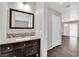 Bathroom with dark vanity and mosaic tile, located near living area and sliding doors at 7257 Early Pioneer Ave, Las Vegas, NV 89129