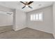 Well-lit bedroom includes carpet, large windows, and mirrored closet doors at 7257 Early Pioneer Ave, Las Vegas, NV 89129