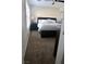Cozy bedroom with neutral tones, features a dark wood bedframe, plush carpet, and ample natural light at 7257 Early Pioneer Ave, Las Vegas, NV 89129