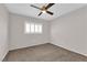 Bedroom with neutral paint, carpet, ceiling fan, and shuttered window at 7257 Early Pioneer Ave, Las Vegas, NV 89129