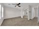 This carpeted bedroom features a ceiling fan and mirrored closet at 7257 Early Pioneer Ave, Las Vegas, NV 89129