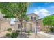 Charming two-story home with a well-manicured lawn and a classic architectural design at 7257 Early Pioneer Ave, Las Vegas, NV 89129