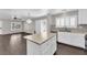 Modern kitchen featuring white cabinets, a mosaic backsplash, and stainless steel appliances at 7257 Early Pioneer Ave, Las Vegas, NV 89129