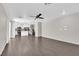Spacious living room with modern wood-look flooring and ample natural light at 7257 Early Pioneer Ave, Las Vegas, NV 89129