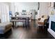 Open-concept living and kitchen area featuring hardwood floors and fireplace at 7257 Early Pioneer Ave, Las Vegas, NV 89129