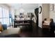 Open concept living area with modern light fixture and stainless kitchen at 7257 Early Pioneer Ave, Las Vegas, NV 89129