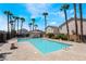 Community pool surrounded by palm trees, offering a refreshing oasis for residents at 7257 Early Pioneer Ave, Las Vegas, NV 89129