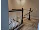 Staircase with dark wood railing and white balusters leading to the upper level at 7257 Early Pioneer Ave, Las Vegas, NV 89129