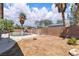 View of the backyard featuring a pool, desert landscaping, and block wall fencing for privacy at 7870 Midnight Ride St, Las Vegas, NV 89131