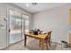 Cozy dining area with sliding door access to the backyard patio at 7870 Midnight Ride St, Las Vegas, NV 89131