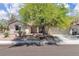 Single-story home with mature landscaping and a spacious driveway at 7870 Midnight Ride St, Las Vegas, NV 89131