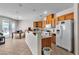 Open kitchen featuring wooden cabinets and modern appliances at 7870 Midnight Ride St, Las Vegas, NV 89131