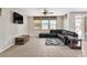 Cozy living room with tile flooring, comfortable seating, and a ceiling fan at 7870 Midnight Ride St, Las Vegas, NV 89131