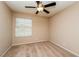 Cozy bedroom with a ceiling fan and natural light from a window at 8205 Harrogate Ave, Las Vegas, NV 89129