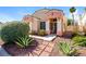 Beautifully landscaped home with manicured shrubs and desert accents at 8205 Harrogate Ave, Las Vegas, NV 89129
