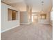 Spacious living room features neutral carpet and an open floor plan at 8205 Harrogate Ave, Las Vegas, NV 89129