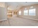 Expansive living room with lots of natural light and neutral colored walls at 8205 Harrogate Ave, Las Vegas, NV 89129