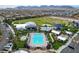 Aerial view of community amenities including a pool, splashpad, recreational field, and well-maintained landscaping at 8958 Howell St, Las Vegas, NV 89166
