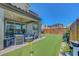 Backyard features a putting green, covered patio, and well-manicured landscaping, perfect for outdoor enjoyment at 8958 Howell St, Las Vegas, NV 89166