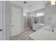 Bright bathroom featuring dual sinks, stone shower and modern fixtures at 8958 Howell St, Las Vegas, NV 89166