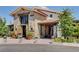 Clubhouse exterior features stone facade, rustic wood accents, tile roof, and meticulously maintained landscaping at 8958 Howell St, Las Vegas, NV 89166