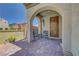 Inviting front porch with covered archways, comfortable seating and a private gated courtyard entry for relaxing outdoors at 8958 Howell St, Las Vegas, NV 89166