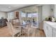 Cozy dining area with views of the backyard and easy access to the kitchen and living room at 8958 Howell St, Las Vegas, NV 89166