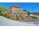 Community entrance sign with stone accents and landscaped flowerbeds at Eagle Pointe at 8958 Howell St, Las Vegas, NV 89166