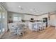 Beautiful kitchen with an island, stainless appliances, white cabinets, and an adjacent dining area at 8958 Howell St, Las Vegas, NV 89166