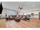 Spacious living room features a plush sofa, modern ceiling fan, and plenty of natural light at 8958 Howell St, Las Vegas, NV 89166