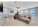 A cozy living room offers a comfortable seating area and ample natural light from multiple windows at 8958 Howell St, Las Vegas, NV 89166