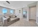 Relax in this inviting living room space with plush seating, neutral tones and an open floorplan at 8958 Howell St, Las Vegas, NV 89166
