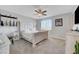 Tranquil main bedroom features a large window, ceiling fan, and tasteful decor at 8958 Howell St, Las Vegas, NV 89166