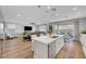 Open-concept living space featuring a modern kitchen, cozy living area, and seamless indoor-outdoor flow at 8958 Howell St, Las Vegas, NV 89166